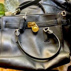 Michael Kors purse, with arm strap and key holder on the inside.